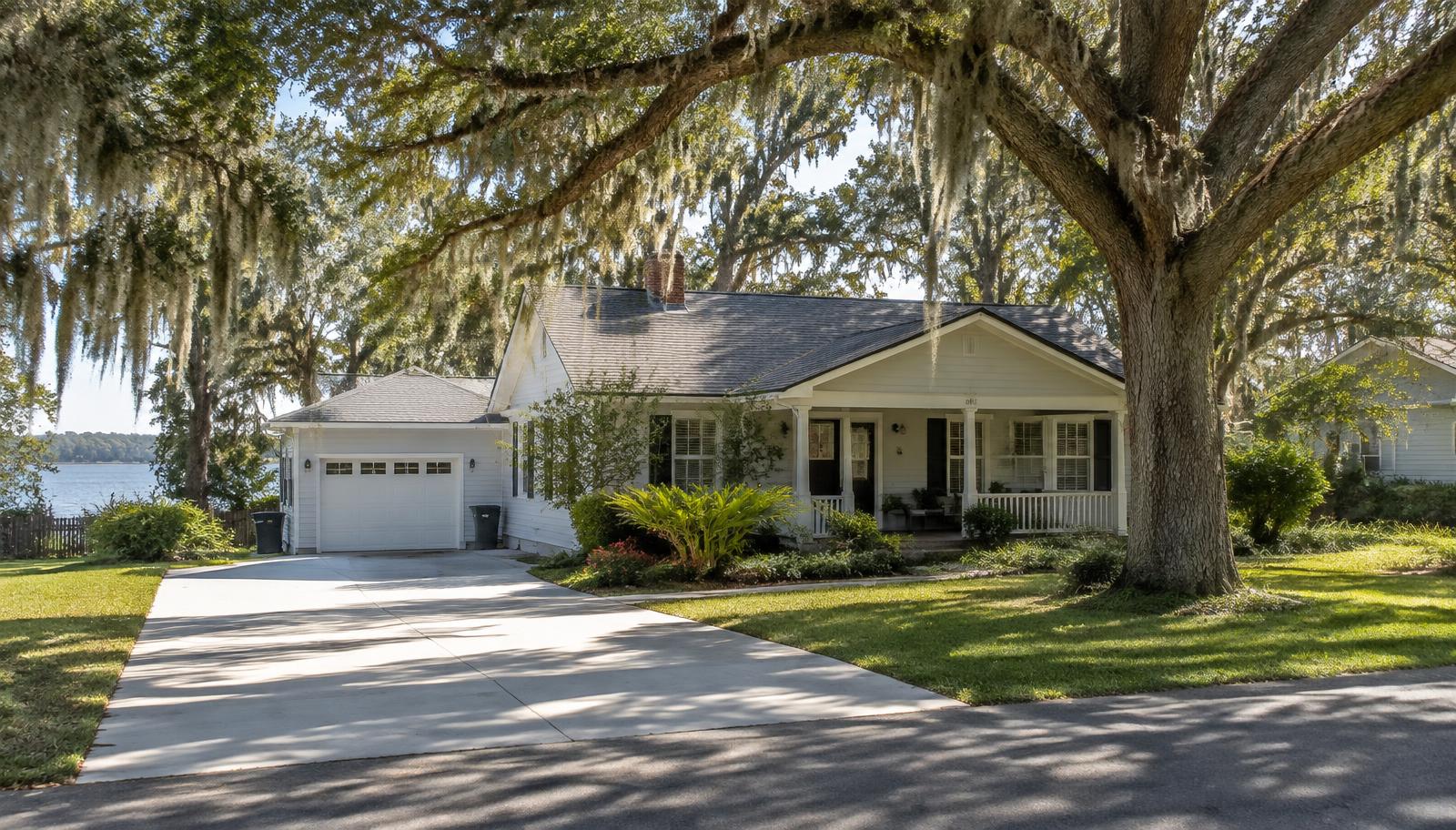 Concrete driveway at an oak-shaded lakeside home in Inverness, FL